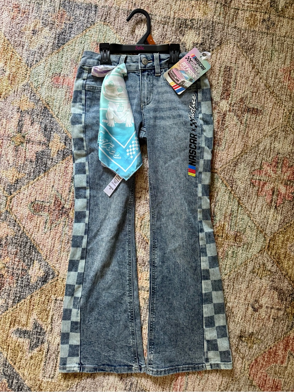 Justice Girls Black Washed Denim Flare Jeans with NASCAR Checkered Side Panels.